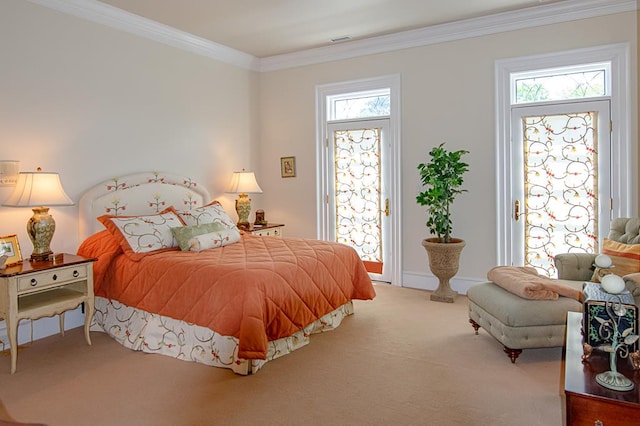 carpeted bedroom featuring ornamental molding and access to exterior