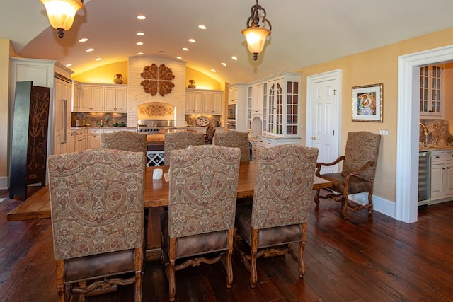 dining area featuring vaulted ceiling, recessed lighting, beverage cooler, and dark wood-style flooring