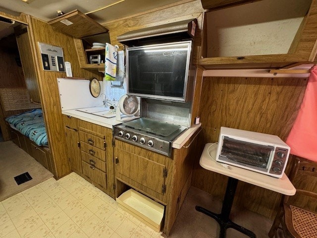 5196 Blue Heron Dr, Horntown, VA 23395 - kitchen with light flooring, brown cabinetry, and light countertops