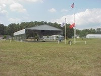 5196 Blue Heron Dr, Horntown, VA 23395 - view of green lawn with a detached carport