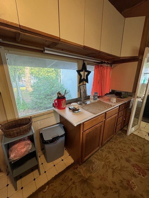 5196 Blue Heron Dr, Horntown, VA 23395 - kitchen with plenty of natural light, dark floors, and light countertops