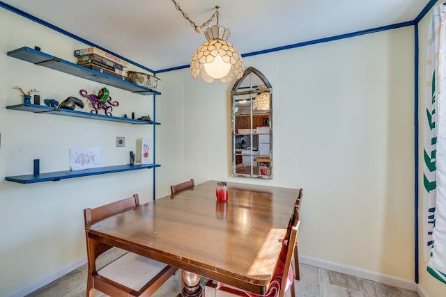 dining area featuring baseboards