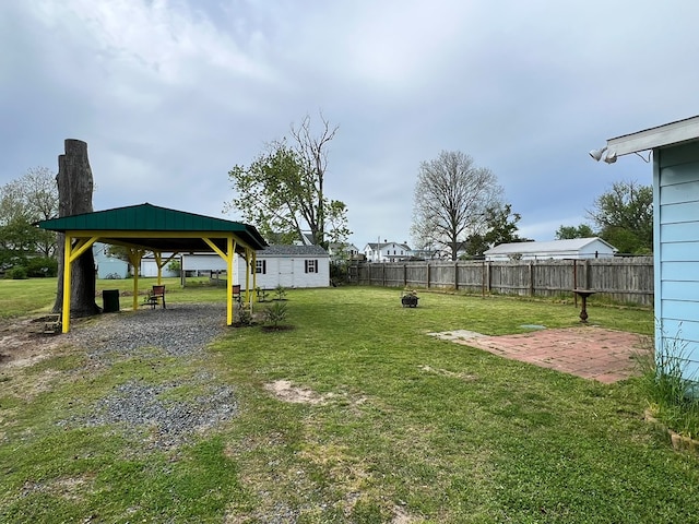 view of yard with a gazebo, a patio, and fence