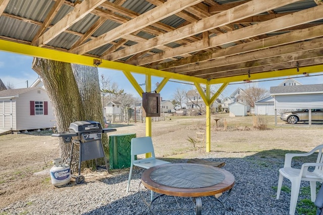 exterior space with a storage unit and an outdoor structure