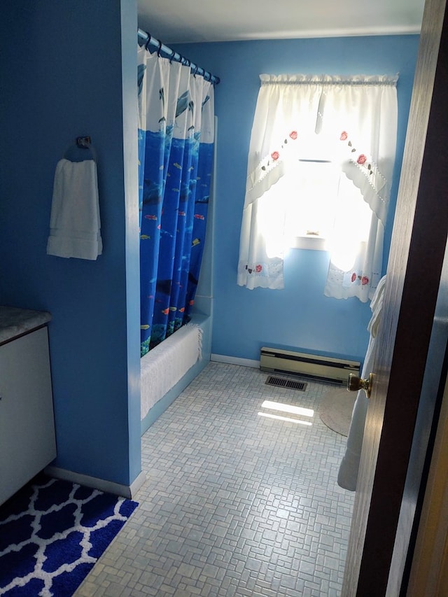 30007 Kilmon Ln, Hacksneck, VA 23358 - bathroom with baseboard heating, shower / tub combo, and brick patterned flooring