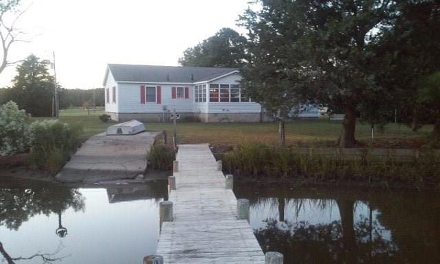 30007 Kilmon Ln, Hacksneck, VA 23358 - dock area featuring a boat ramp, a lawn, and a water view
