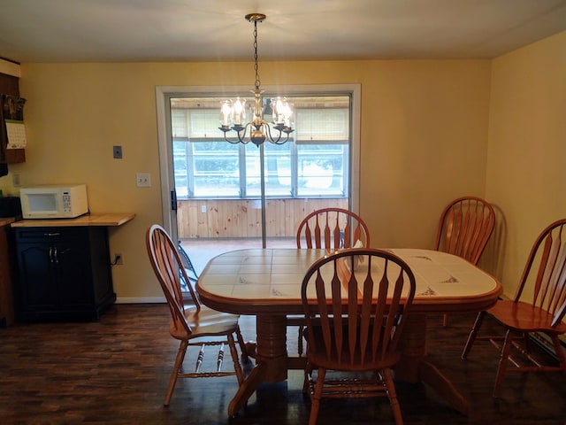 30007 Kilmon Ln, Hacksneck, VA 23358 - dining room featuring a chandelier and dark wood-type flooring