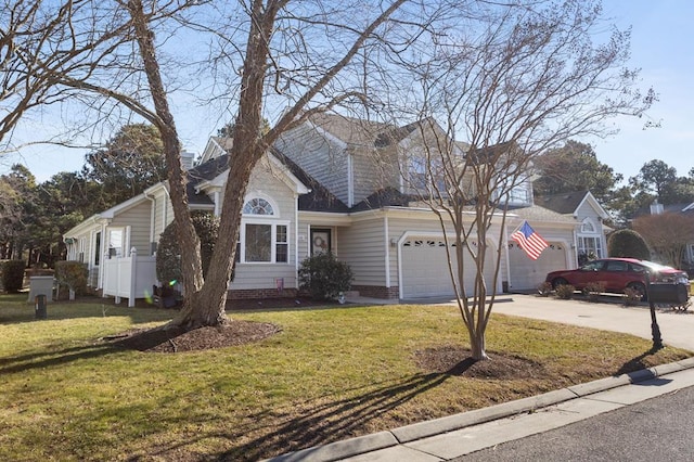 view of front of house with a garage and a front yard