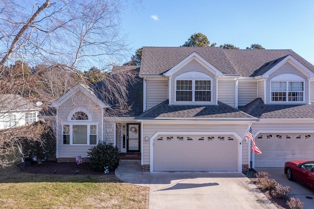 view of front property featuring a garage and a front yard