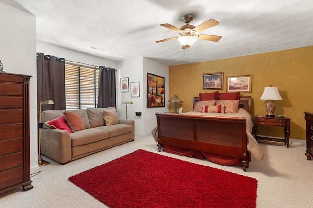 bedroom with light colored carpet and ceiling fan