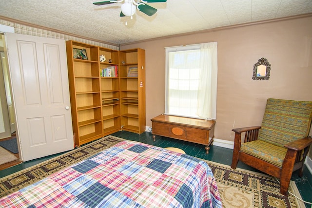 bedroom featuring ornamental molding, baseboards, and ceiling fan