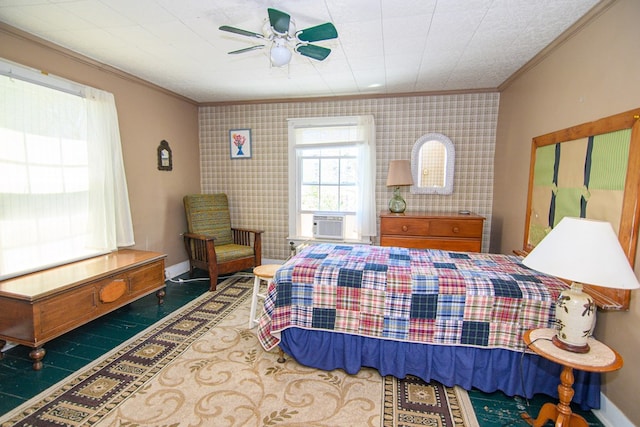 bedroom featuring cooling unit, baseboards, ornamental molding, and a ceiling fan