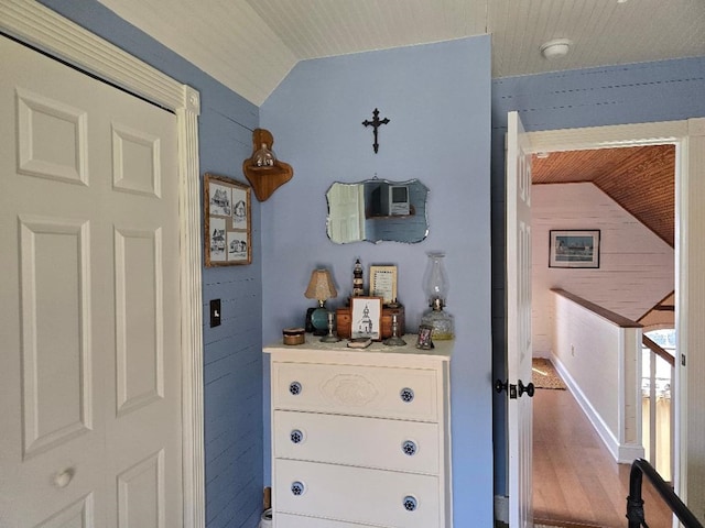 details with wood finished floors and wooden walls