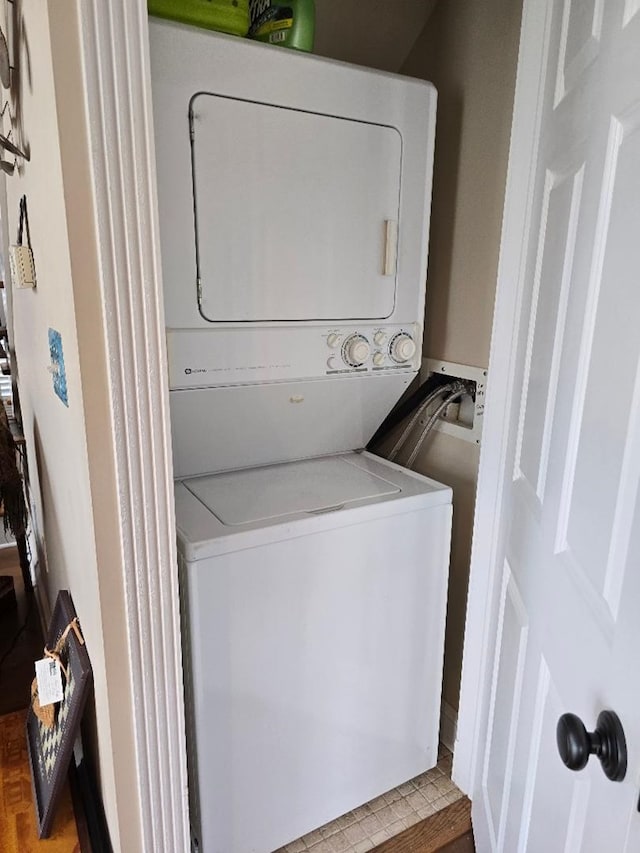 washroom with stacked washer and clothes dryer