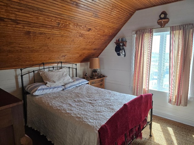 carpeted bedroom featuring wood ceiling and vaulted ceiling