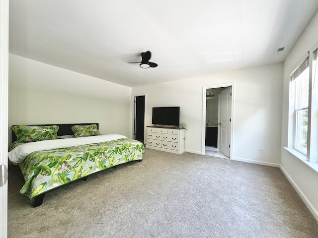 bedroom featuring multiple windows, carpet floors, and ceiling fan