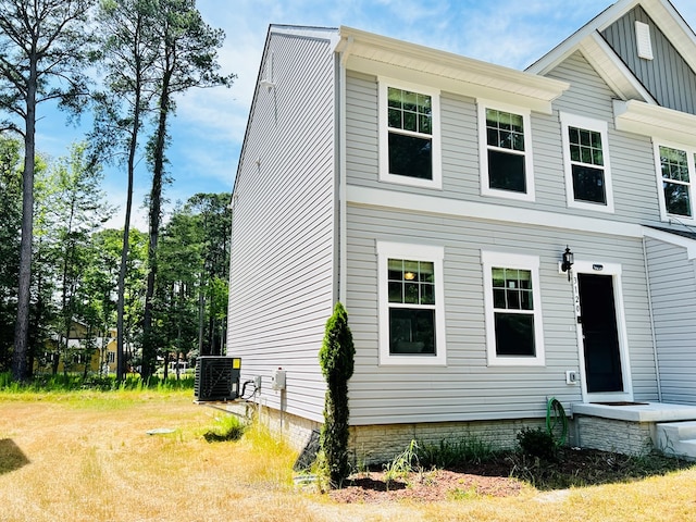 view of front of home featuring central air condition unit