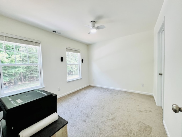 interior space featuring ceiling fan