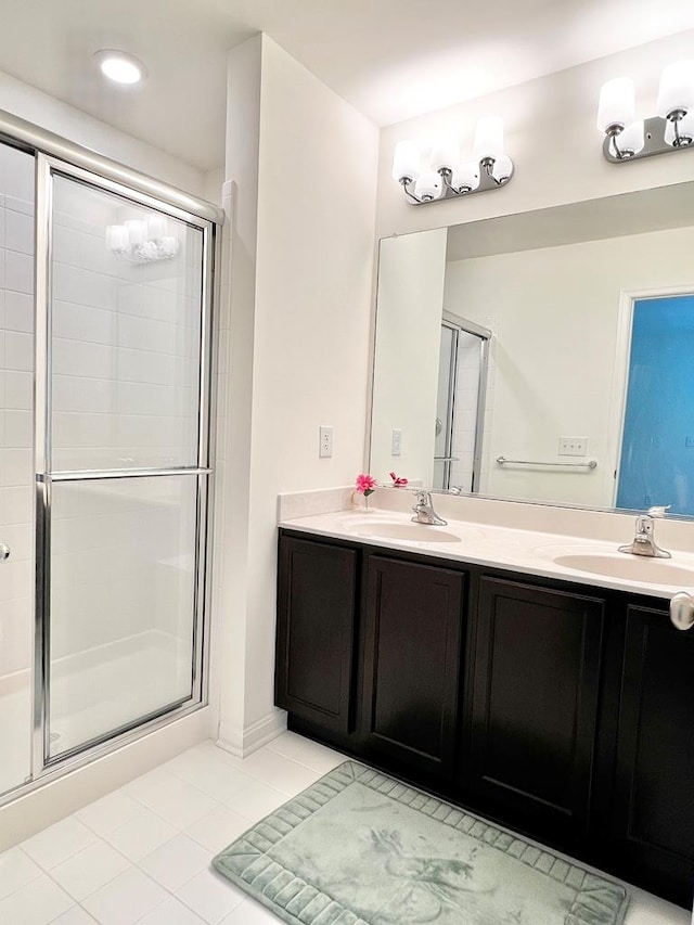 bathroom with vanity, tile patterned floors, and walk in shower