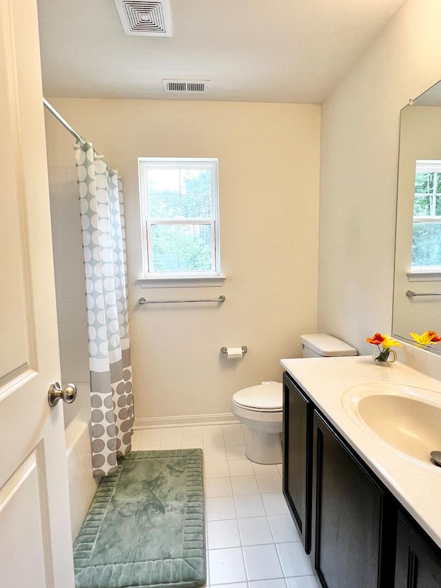 full bathroom with tile patterned flooring, vanity, shower / bath combo, and toilet