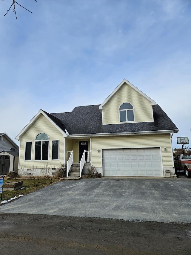 view of front facade with crawl space, a garage, and driveway