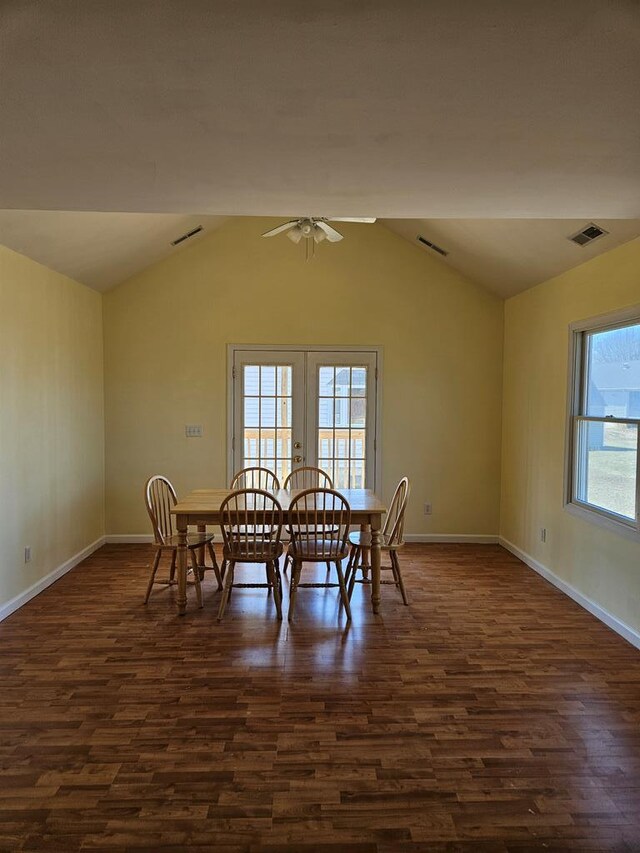 dining area with dark hardwood / wood-style floors, vaulted ceiling, french doors, and ceiling fan