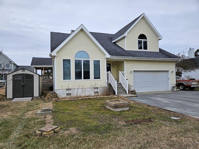 view of front of house featuring aphalt driveway, a garage, an outdoor structure, crawl space, and a storage unit