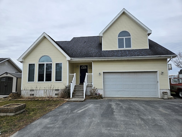 view of front facade with crawl space, driveway, and a shingled roof