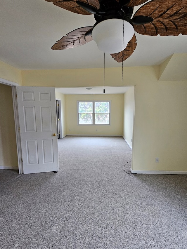 carpeted empty room with ceiling fan