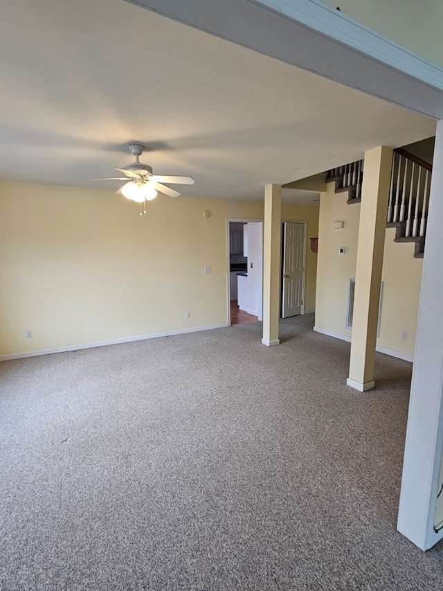 carpeted empty room featuring ceiling fan