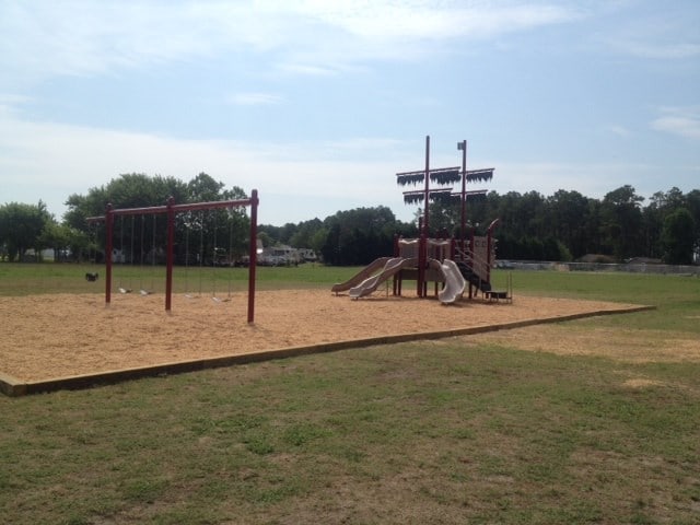 view of playground with a yard