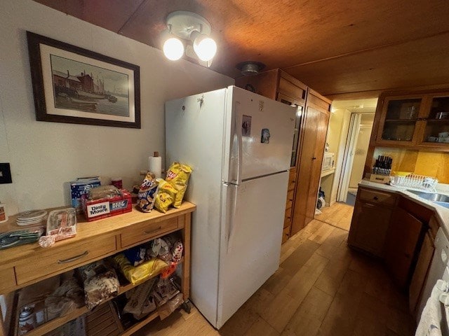 kitchen featuring white fridge and light hardwood / wood-style flooring