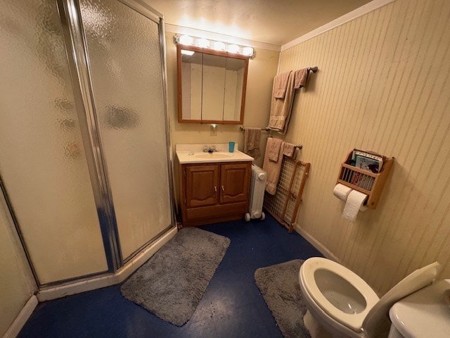 bathroom with radiator, an enclosed shower, toilet, vanity, and ornamental molding