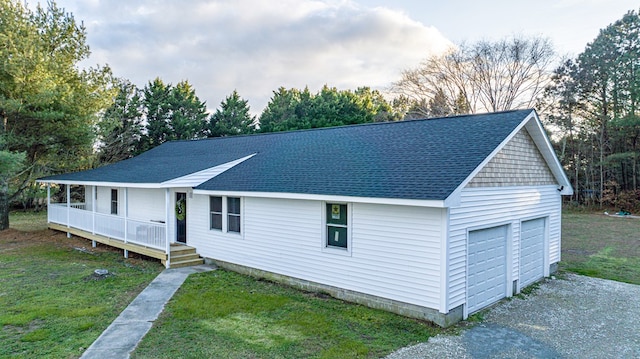 view of front facade featuring an outbuilding and a front yard