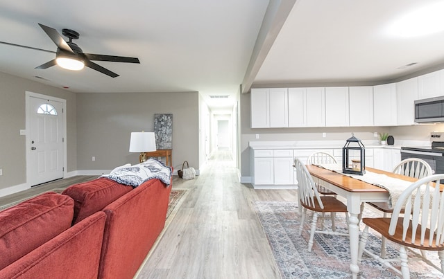 interior space featuring ceiling fan and light hardwood / wood-style floors