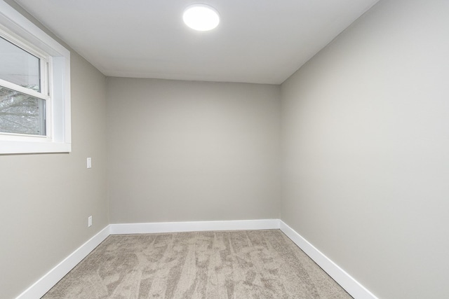 empty room featuring light colored carpet