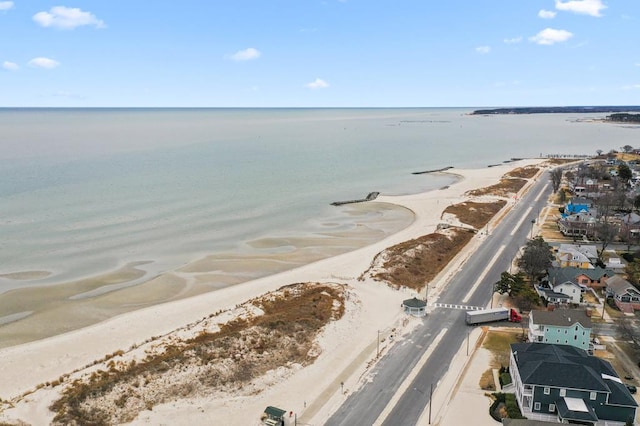 aerial view with a water view and a view of the beach