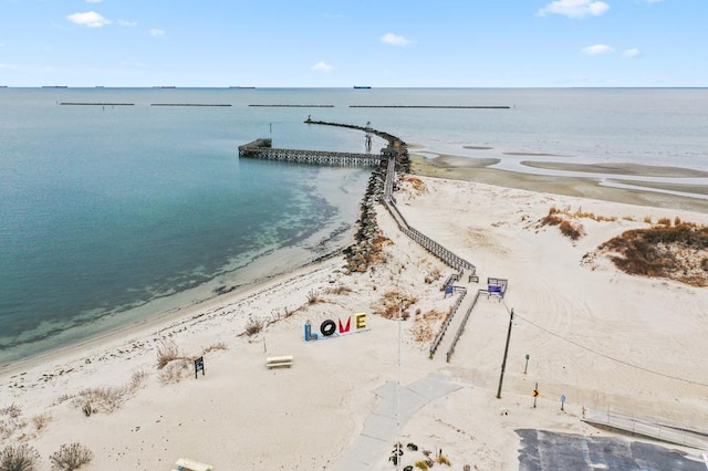 drone / aerial view featuring a view of the beach and a water view