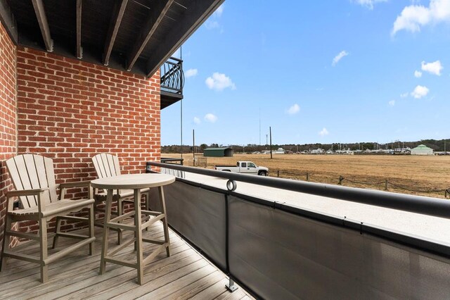 balcony featuring a rural view