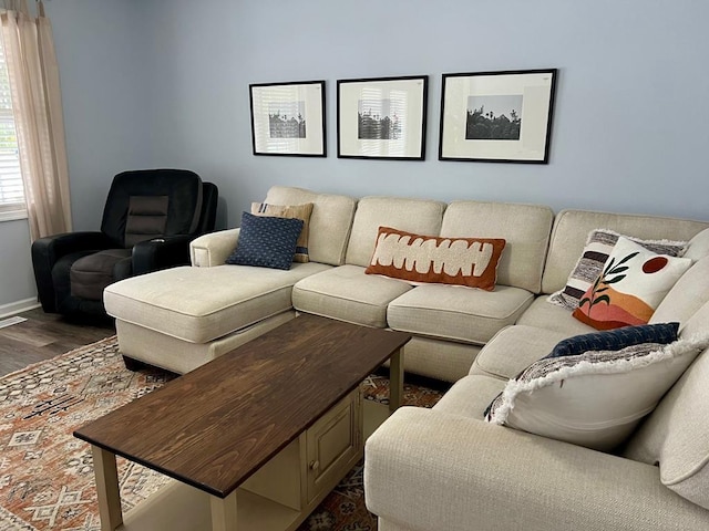 living room featuring dark wood-type flooring