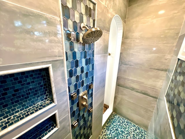 bathroom with tiled shower