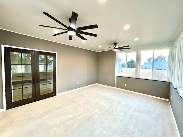 carpeted empty room with ceiling fan and french doors