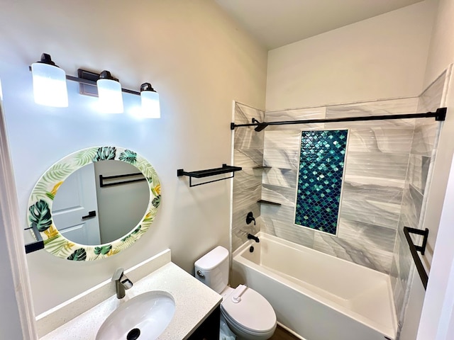 full bathroom with tiled shower / bath combo, toilet, and vanity