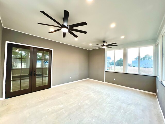 unfurnished room featuring ceiling fan, french doors, and light carpet