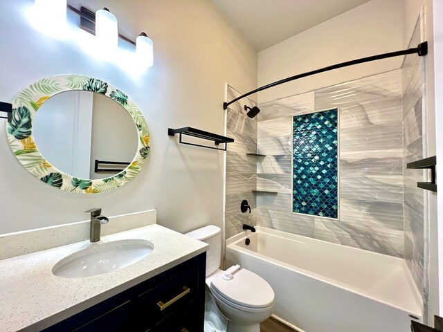 full bathroom with vanity, toilet, and tiled shower / bath