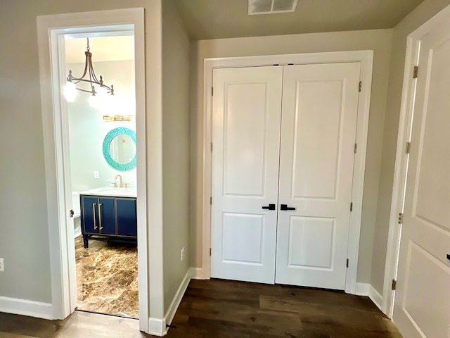 3102 Cutter Ct, Greenbackville, VA 23356 - hallway with baseboards and dark wood-type flooring