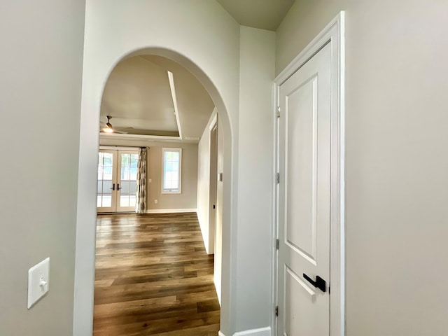 hall with french doors and dark wood-type flooring