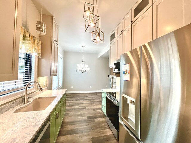3102 Cutter Ct, Greenbackville, VA 23356 - kitchen featuring stainless steel appliances, dark wood finished floors, glass insert cabinets, pendant lighting, and light stone countertops