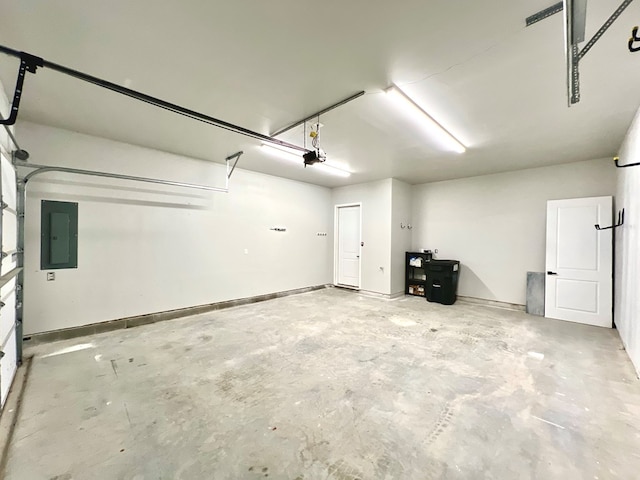 garage featuring electric panel and a garage door opener