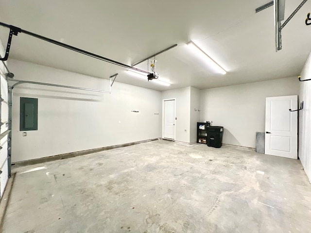 3102 Cutter Ct, Greenbackville, VA 23356 - garage featuring electric panel and a garage door opener